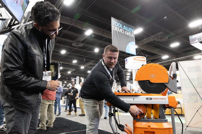 Exhibitor running a table saw