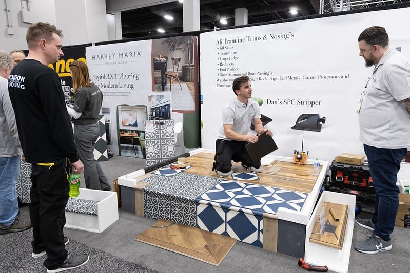 Exhibitor talking to attendees at tise 2024